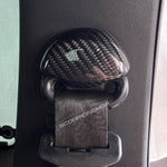 Carbon fiber seat belt fastening cover